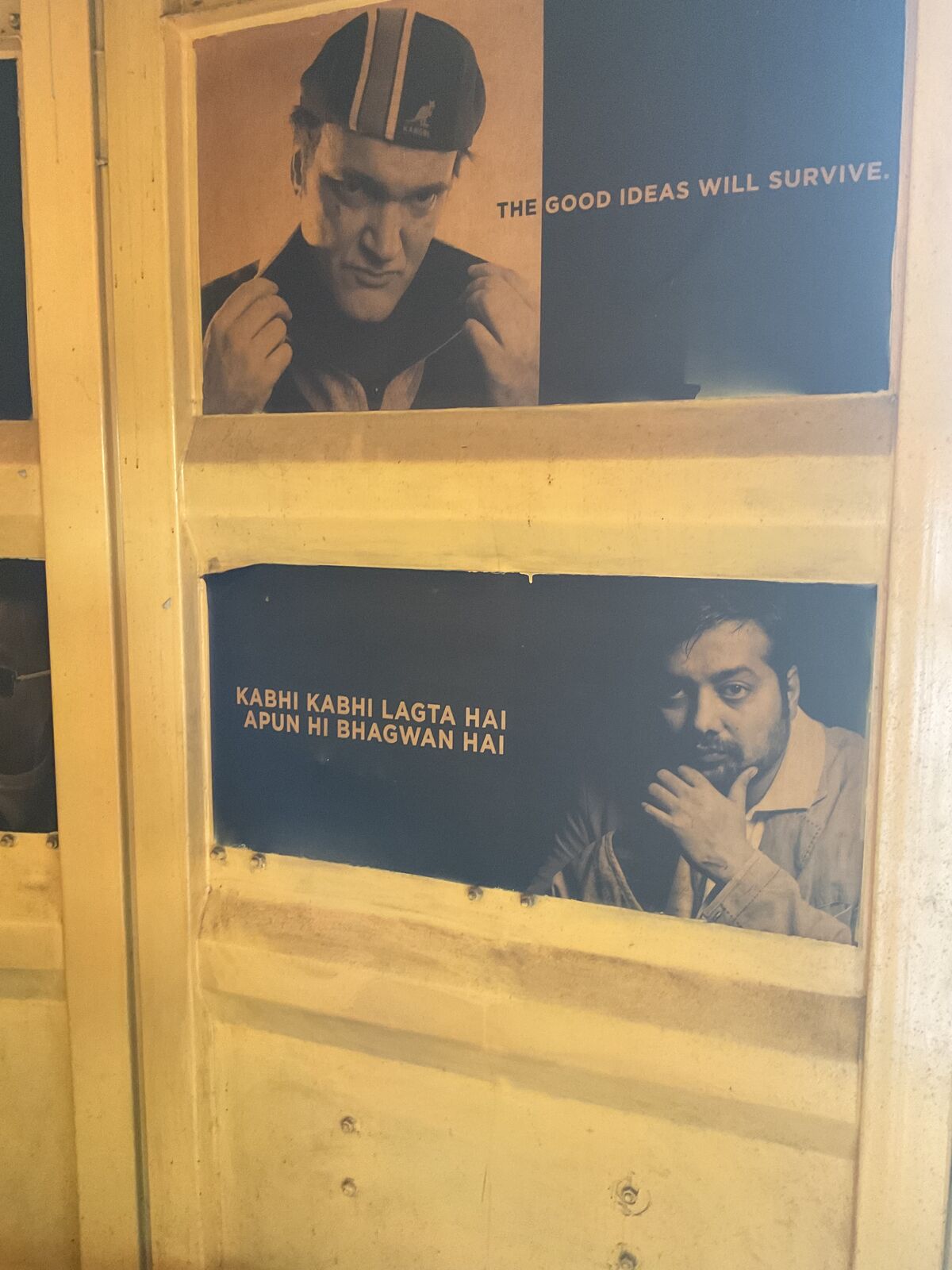 Posters on a wooden wall at Chiyawala, Thapathali, one reading The good ideas will survive