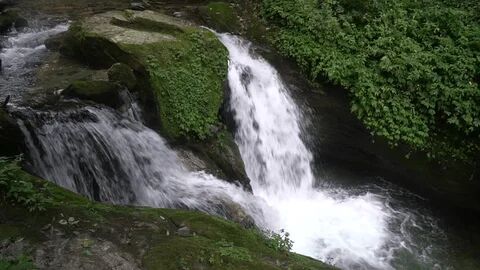 Waterfall over mossy rocks